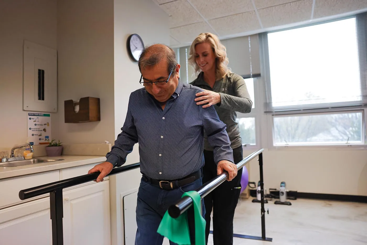 Physical therapist helping patient